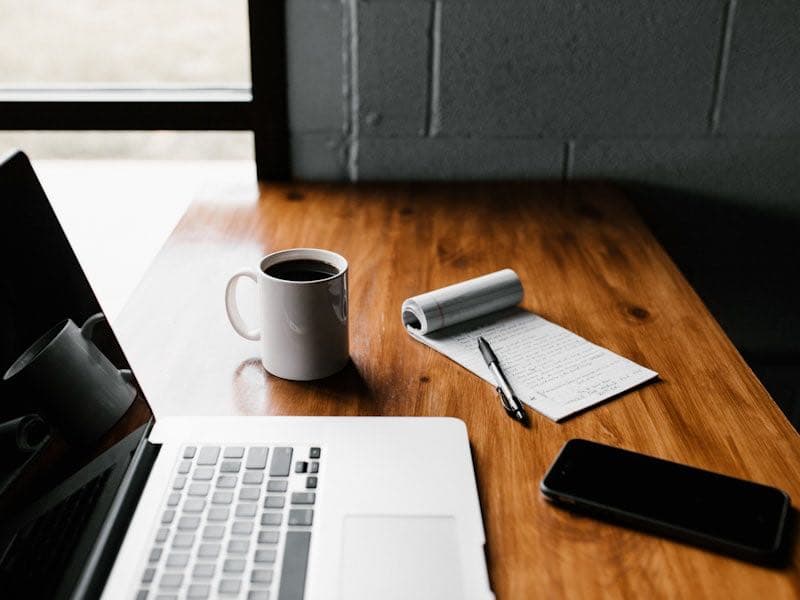 Freelancer setting up booking page on laptop