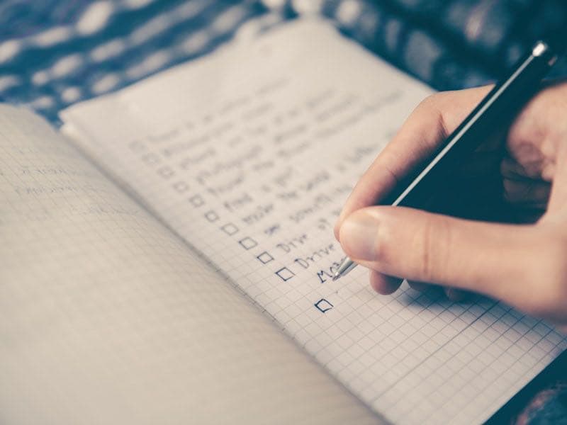 Person planning appointments on laptop